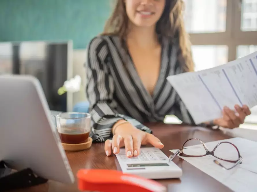 Young woman working on taxes.